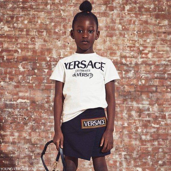 Young Versace Kids Celebrates Diversity White T-shirt Black Skirt